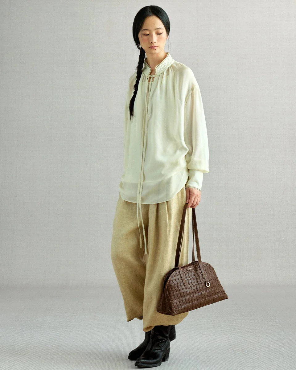Handbag with lattice shellseeker pattern